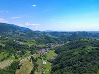 an aerial view of a village in the mountains